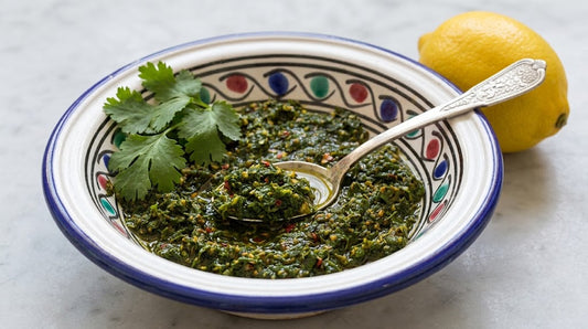 Fresh Moroccan Chermoula Herb Sauce in Hand-Painted Bowl with Spoon and Lemon