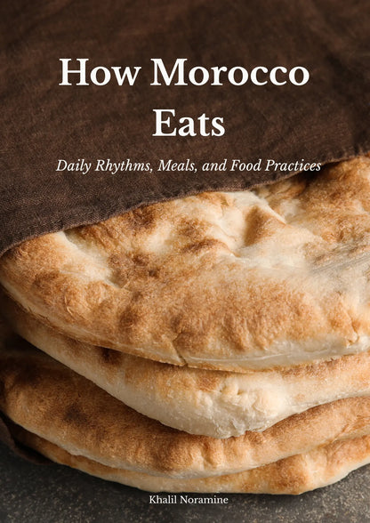 How Morocco Eats ebook cover featuring traditional Moroccan bread stacked beneath a brown cloth